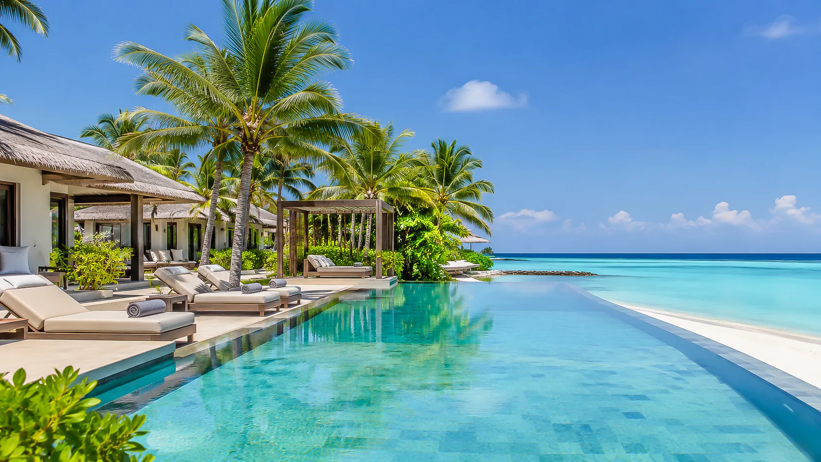 Luxury overwater villas in a clear Maldives lagoon